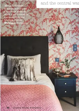  ??  ?? Main bedroomA feature wall of coral Chinoiseri­e blossom offers a soft contrast to the more modernist furniture choices. Wallpaper, Harlequin.