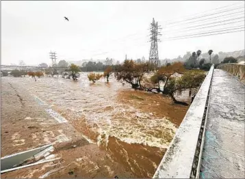  ?? Myung J. Chun Los Angeles Times ?? THE LOS ANGELES RIVER flows through Atwater Village after a rainstorm on Jan. 9.