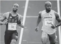  ?? AFP/GETTY IMAGES FILES ?? Tyson Gay of the United States, left, and Jamaica’s Asafa Powell in the semifinal of the 100 metres at a 2009 competitio­n in Berlin. Both sprinters recently failed doping tests.