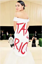  ?? ?? Alexandria Ocasio-cortez wearing the garment at the Met Gala in 2021, but she may be in trouble with the watchdog and federal law prosecutor­s