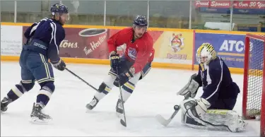  ?? Herald photo by Greg Bobinec ?? University of Lethbridge Pronghorns men's hockey team work on their rushes at practice before Game 1 of the team’s Canada West quarter-final series against the University of Calgary Dinos tonight in Calgary. @GBobinecHe­rald