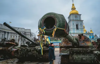  ?? DIMITAR DILKOFF/GETTY-AFP ?? A man looks at destroyed Russian military equipment Monday at a square in downtown Kyiv, Ukraine.