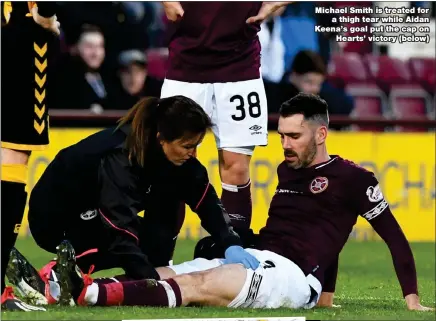  ??  ?? Michael Smith is treated for a thigh tear while Aidan Keena’s goal put the cap on Hearts’ victory (below)