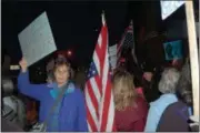  ?? IVAN LAJARA — DAILY FREEMAN ?? A demonstrat­or hold up a sign calling on the U.S. Senate to protect special counsel Robert Mueller.