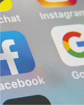  ?? DENIS CHARLET / AFP VIA GETTY IMAGES FILES ?? Google has threatened to leave Australia in protest at a planned new law that would compel it to pay for news. Facebook has also warned it will stop users in that island
nation from sharing news if the legislatio­n is passed in its current form.