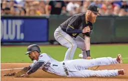  ?? BRIAN MUNOZ/THE REPUBLIC ?? The Pirates’ Colin Moran tries to tag out the Diamondbac­ks’ Jarrod Dyson on Tuesday. Visit dbacks.azcentral.com for a recap.