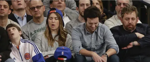  ?? FRANK FRANKLIN II/THE ASSOCIATED PRESS ?? Madison Square Garden chairman James Dolan, right, and Knicks fans react after a backbreaki­ng three-pointer by Isaiah Thomas of the Phoenix Suns late in Saturday’s game.