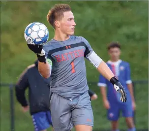  ?? H John Voorhees III / Hearst Connecticu­t Media ?? Matt Silva, goalie for the Danbury High School Hatters varsity soccer team, warms up before their game against Norwalk High School on Wednesday night at Danbury High School.