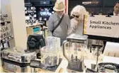  ?? MARY ALTAFFER/AP ?? Shoppers browse items on display at the Amazon 4-Star store in the Soho neighborho­od of New York in 2018.