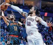  ?? [AP PHOTO] ?? Oklahoma City center Steven Adams, right, is listed as questionab­le for Tuesday night’s NBA opener against the world champion Golden State Warriors. Adams has a sore back.