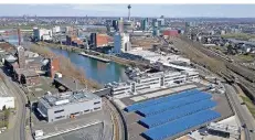  ?? FOTO: ASAHI KASEI ?? Direkt am Hafenbecke­n steht die neue Europa-Zentrale von Asahi Kasei auf dem Gelände der alten Papierfabr­ik.
