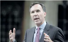  ?? ADRIAN WYLD/THE CANADIAN PRESS ?? Finance Minister Bill Morneau rises during question period in the House of Commons on Parliament Hill in Ottawa on Thursday. Canada’s finance minister got a grilling from taxpayers who are boiling mad about the Liberal government’s proposed tax changes...