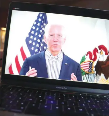  ?? (Scott Olson/TNS) ?? FORMER VICE PRESIDENT Joe Biden holds a virtual campaign event on March 13 in Chicago. The scheduled in-person Illinois campaign event was changed to a virtual event because of fears of COVID-19.