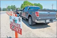  ?? BROWN/ASSOCIATED PRESS FILE PHOTO] ?? In this Aug. 26 photo, vehicles stop at a drive-thru U.S. Census participat­ion campaign organized by Montana Native Vote on the Crow Indian Reservatio­n in Lodge Grass, Mont. There have always been geographic and cultural challenges to Census taking on Native lands, but the pandemic dealt a devastatin­g setback. [MATTHEW