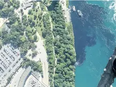  ?? PATRICK J. PROCTOR/RAINBOW AIR INC., VIA AP ?? In this July 29 photo, black-coloured wastewater treatment discharge is released into water below Niagara Falls, in Niagara Falls, N.Y. The water near the base of the falls that borders the U.S. and Canada turned an alarming shade of black before...