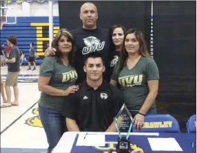  ??  ?? Blake Zeleny (seated, center) smiles for a photo surrounded by family members after signing his letter of intent to play baseball at Utah Valley during a signing ceremony at BUHS earlier this week. KARINA LOPEZ PHOTO