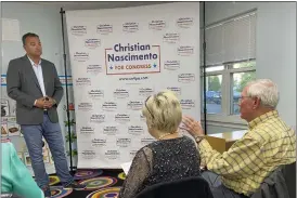  ?? EVAN BRANDT — MEDIANEWS GROUP ?? Congressio­nal candidate Christian Nascimento, left, listens to a voter express concerns about the nation’s energy policy during a town hall Tuesday at Magnolia Children’s Academy in Douglass (Mont.).