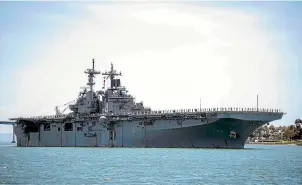  ?? AP ?? This photo provided by the US Navy shows the amphibious assault ship USS Boxer (LHD 4), which President Donald Trump says destroyed an Iranian drone in the Strait of Hormuz.