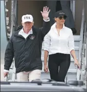  ?? TOM REEL/ SAN ANTONIO EXPRESS-NEWS ?? President Donald Trump, left, and first lady Melania Trump arrive at the Corpus Christi Internatio­nal Airport on Tuesday in Corpus Christi, Texas. Trump travelled to Texas on Tuesday to see the recovery efforts underway in the aftermath of Tropical...