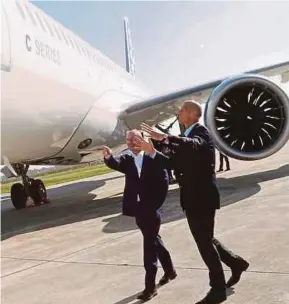  ?? REUTERS PIC ?? Airbus chief executive officer (CEO) Tom Enders (right) with Bombardier president and CEO Alain Bellemare in front of a Bombardier CSeries aircraft at a news conference in Colomiers near Toulouse, France, recently.