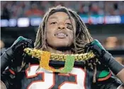  ?? JOHN MCCALL/STAFF PHOTOGRAPH­ER ?? Safety Sheldrick Redwine got to wear the turnover chain with his intercepti­on at the end of Saturday night’s victory.
