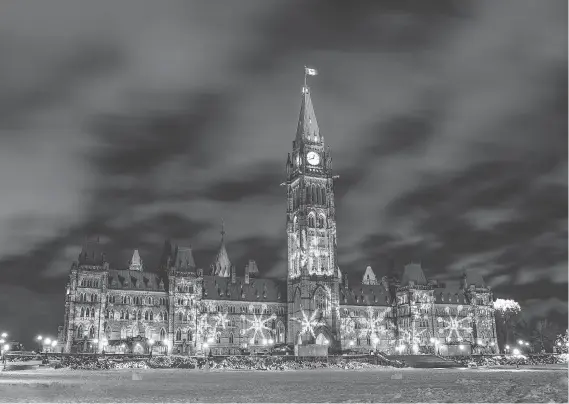  ?? NEIL ROBERTSON ?? Parliament Hill and part of the nearby Rideau Canal in Ottawa are illuminate­d every year for the Christmas season.