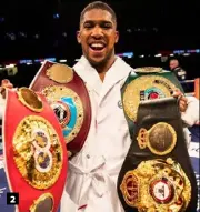  ??  ?? 1. Joseph Parker makes his way to the ring. 2. Anthony Joshua after his unanimous points win. 3. Joshua (right) boxed – rather than fought – his way to victory. 2