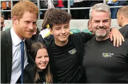  ?? ?? Support: Prince Harry with Emily, Isaac and Matt Briggs