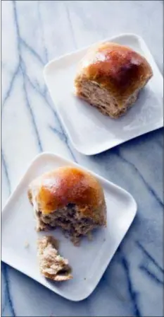  ?? CARL TREMBLAY — AMERICA’S TEST KITCHEN VIA AP ?? This undated photo provided by America’s Test Kitchen in November 2018 shows honey-wheat dinner rolls in Brookline, Mass. This recipe appears in the cookbook “Bread Illustrate­d.”