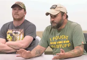  ?? MARK HOFFMAN / MILWAUKEE JOURNAL SENTINEL ?? Army veteran Samuel Hipp (right) talks about his service while fellow veteran Zach Nelson listens while participat­ing in a discussion with a group of mental health profession­als Thursday at Fort McCoy.