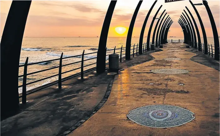  ?? Picture: visitdurba­n.travel ?? THEM BONES The Indian Ocean seen through the Whale Bone Pier at Umhlanga Rocks.