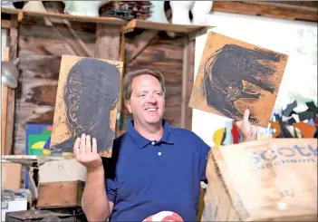  ??  ?? ‘Legacy List’ host Paxton holds up pieces from artist David Hayes at his studio in Coventry, Conn., in an episode from season two of the show.