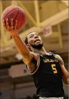  ?? Gregory Shemitz / Special to Times Union ?? UAlbany's Jamel Horton goes to the basket against Stony Brook in their game Saturday. Horton was 6-for-17 from the field for 14 points.