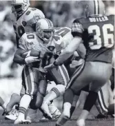  ?? PACKER PLUS FILES ?? Dolphins running back Irving Spikes cuts through the Packers defense at County Stadium in 1994. Spikes had 70 yards on 13 carries.