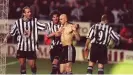  ?? John Giles/PA ?? Newcastle United players Darren Peacock and Pistone calm down Temuri Ketsbaia after his furious goal celebratio­n against Bolton. Alan Shearer (right) retrieved his shirt from the stands. Photograph: