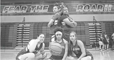 ??  ?? The top players from Millennium’s girls basketball team pose before their practice on Monday at Millennium High School on Monday.