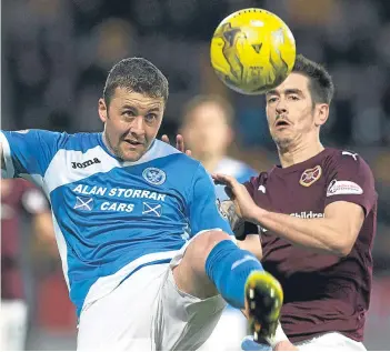  ?? All pictures: SNS Group. ?? Left: Joe Shaughness­y heads home St Johnstone’s winning goal; above: Tam Scobbie in a battle with Hearts’ Jamie Walker.