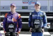  ?? TERRY RENNA — THE ASSOCIATED PRESS ?? Front row winner Denny Hamlin, left, and pole sitter Alex Bowman hold their trophies in victory Lane after they qualified for the top two starting spots for the NASCAR Daytona 500 auto race at Daytona Internatio­nal Speedway, Sunday in Daytona Beach, Fla.