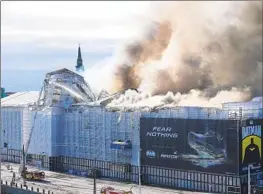  ?? Emil Helms Ritzau Scanpix ?? THE OLD Stock Exchange building in Copenhagen caught fire during renovation­s. The Danish capital’s police said it was too early to say what caused the blaze.