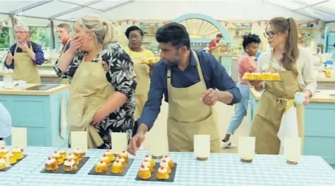  ??  ?? Bun fight
The contestant­s on the Great British Bake Off battled in the tent to impress the judges