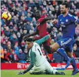  ?? THE ASSOCIATED PRESS ?? Liverpool’s Sadio Mane scores his side’s fourth goal during a match against Cardiff City, in Liverpool on Saturday.