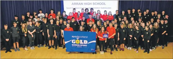  ?? 01_B43gold01 ?? Arran High School pupils are delighted to receive a sportscotl­and gold award on behalf of the Lamlash campus, for the second time, at a special assembly. The sportscotl­and awards are presented every two years to schools that demonstrat­e a high standard of sporting ability and opportunit­ies – and the gold award is the highest level achievable.