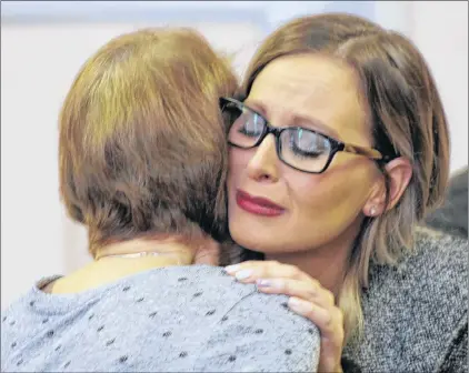  ?? TARA BRADBURY/THE TELEGRAM ?? Quinn Butt’s mother, Andrea Gosse, hugs her own mother and weeps upon learning it will be another year before Quinn’s father, Trent Butt, will go to trial. Butt, 39, is charged with first-degree murder and arson in connection with the little girl’s...