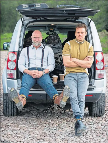  ?? ?? Actors Graham McTavish and Sam Heughan take time out from filming Clanlands at Loch Awe
Picture Peter Sandground