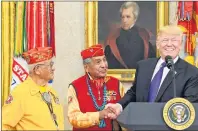  ?? AP PHOTO ?? U.S. President Donald Trump meets with Navajo Code Talkers Peter MacDonald, centre, and Thomas Begay in the Oval Office of the White House in Washington Monday.