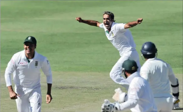  ?? PICTURE: GALLO IMAGES ?? IN FULL FLIGHT: Imran Tahir of South Africa celebrates the prized wicket of Kumar Sangakkara of Sri Lanka for 34 runs during day three of the third Test at Sahara Park Newlands in Cape Town.