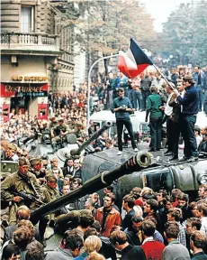  ?? Picture: Getty Images ?? Soviet soldiers and tanks try to get to the headquarte­rs of Czechoslov­ak Radio in Prague through streets packed with protesters in August 1968. The Soviet invasion ended Alexander Dubcek’s ‘Prague Spring’.