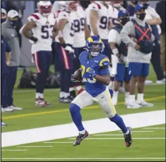  ?? Associated Press ?? BREAKING AWAY — Los Angeles Rams running back Cam Akers (23) sprints with the ball against the New England Patriots on Thursday in Inglewood. Akers rushed for 171 yards in the Rams’ win.