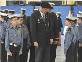  ??  ?? Moose Jaw Legion president Roy Labuick conducts the inspection of Moose Jaw Navy League cadets.