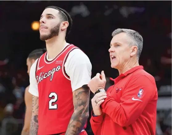  ?? NAM Y. HUH/AP ?? Bulls coach Billy Donovan (right) acknowledg­ed that guard Lonzo Ball is facing an uphill battle and ‘‘certainly has a long road to recovery.’’